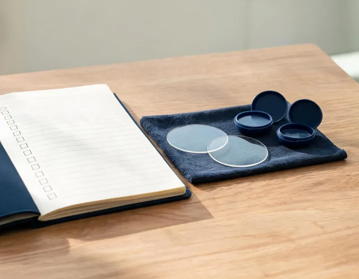 Independent procurement desk reviewing replacement lens briefs
